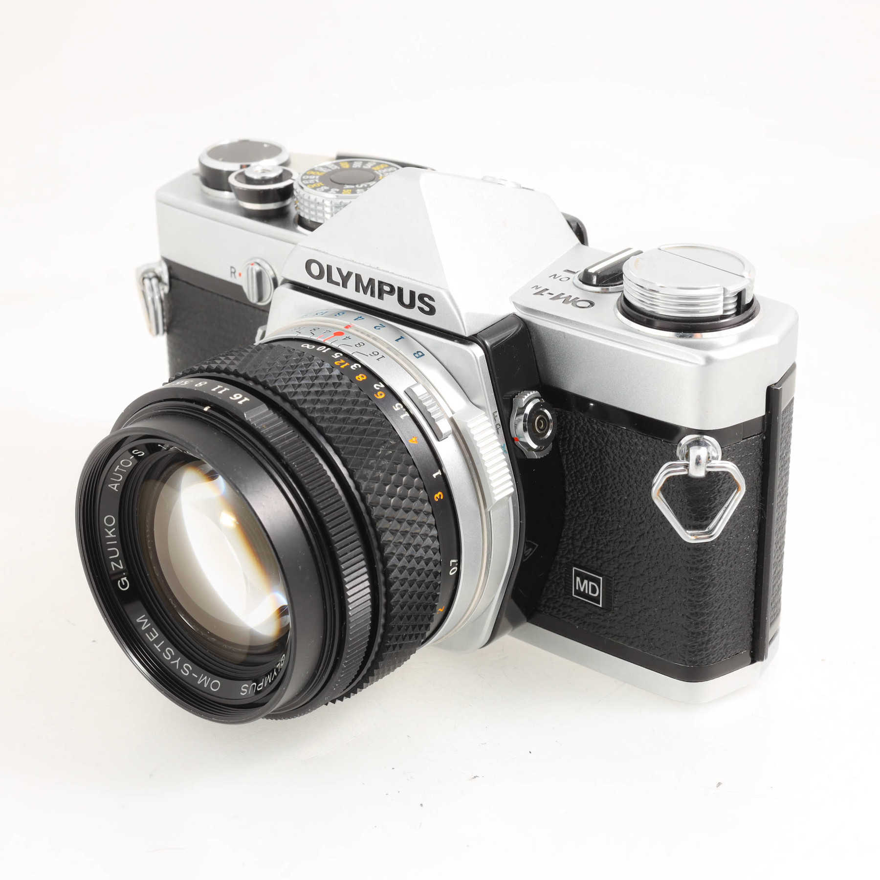 Olympus OM-1n с объективом 50mm f/1.4 G.Zuiko Auto-S Olympus OM-1n с объективом 50mm f/1.4 G.Zuiko Auto-S